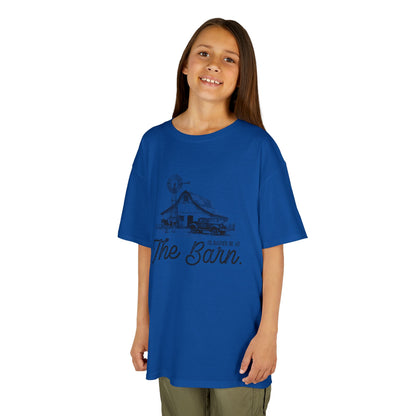 Child wearing a blue t-shirt with text on a white background