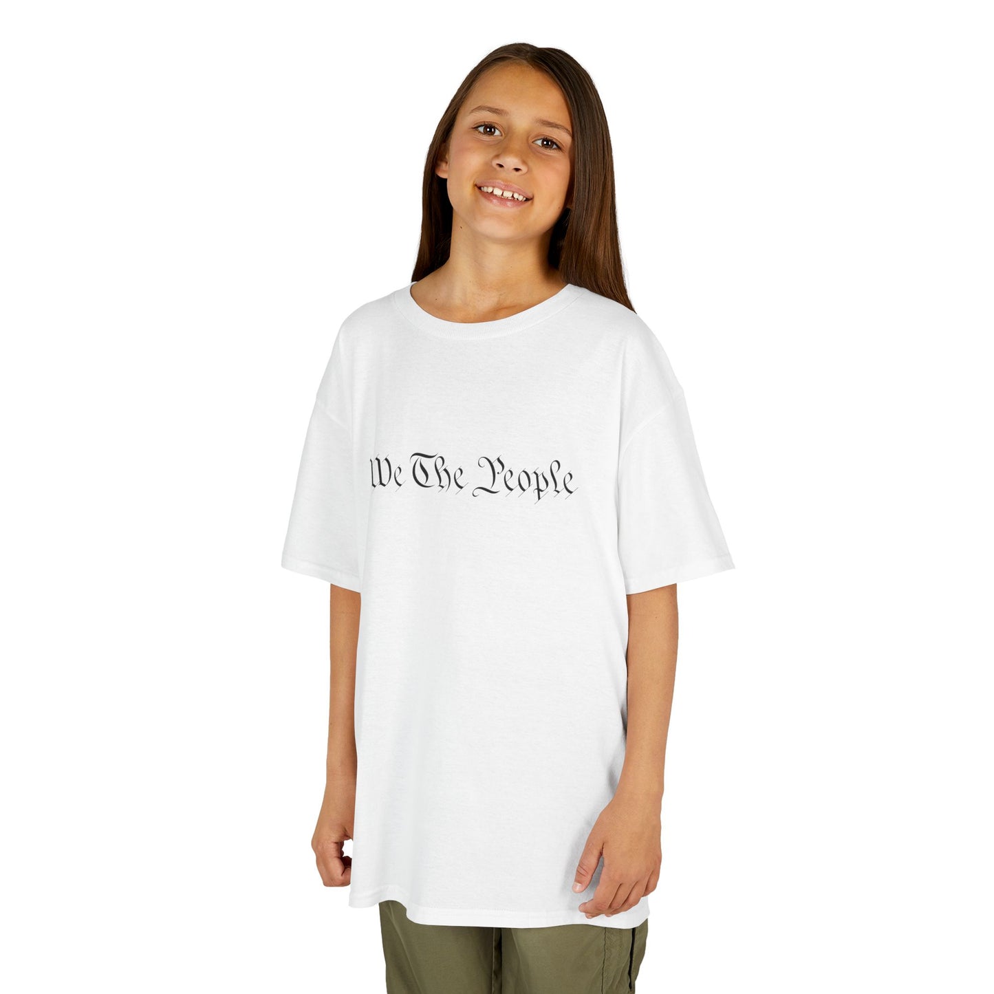Young girl wearing a white t-shirt with a graphic design on a white background