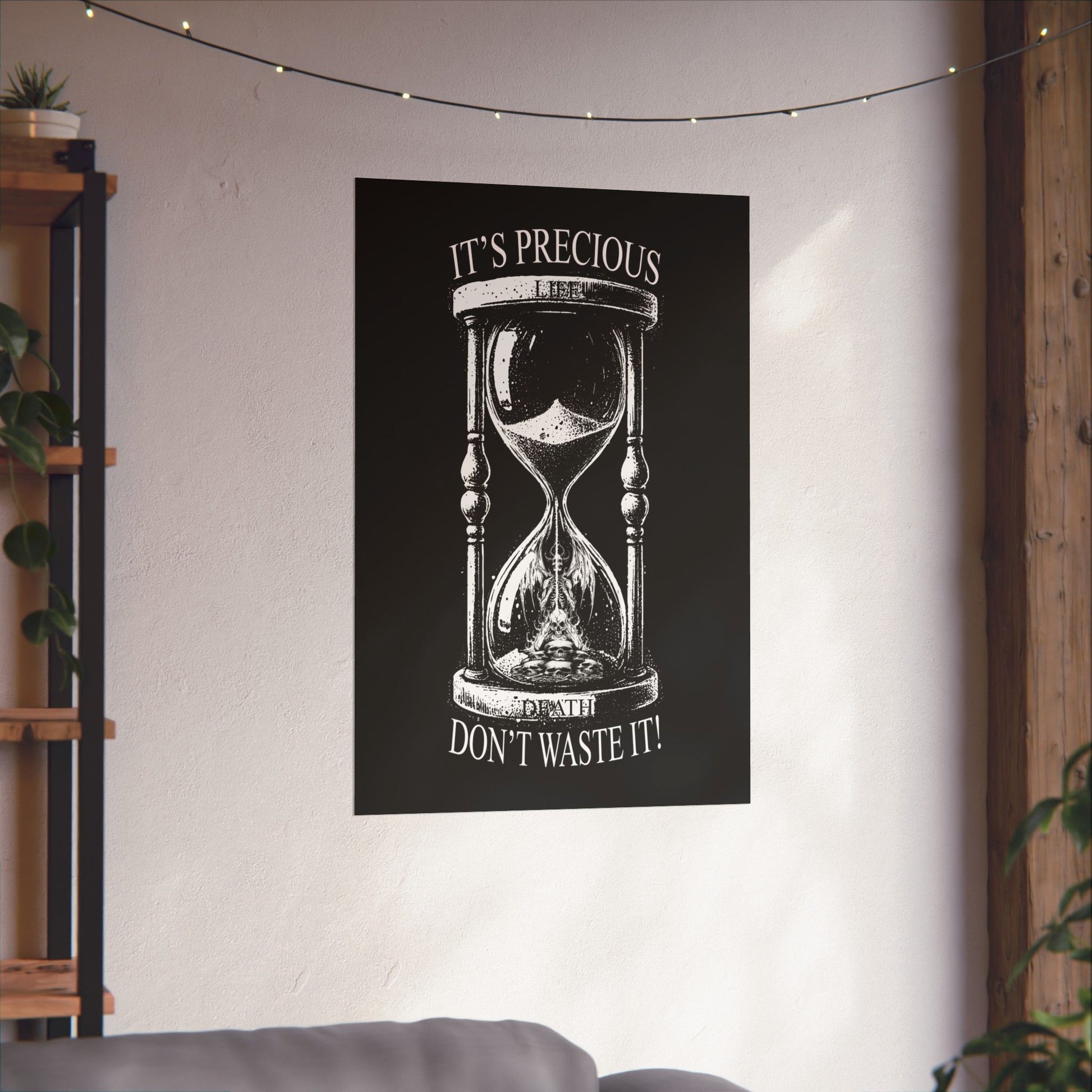 Poster with an hourglass design and motivational text on a wall in a room.