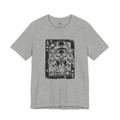Gray t-shirt with a graphic design of a skull wearing a hat and sunglasses on a white background
