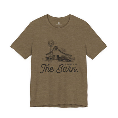 Brown t-shirt with a graphic of a barn and truck, and text 'I'd rather be at The Barn'