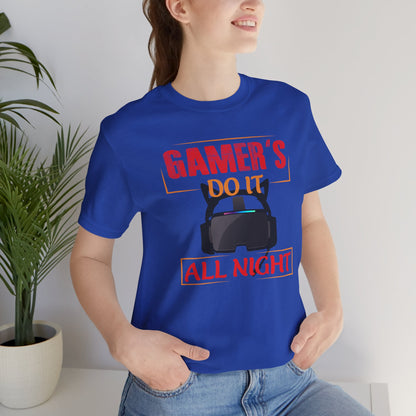 Person wearing a blue t-shirt with 'GAMER'S DO IT ALL NIGHT' text and graphics.
