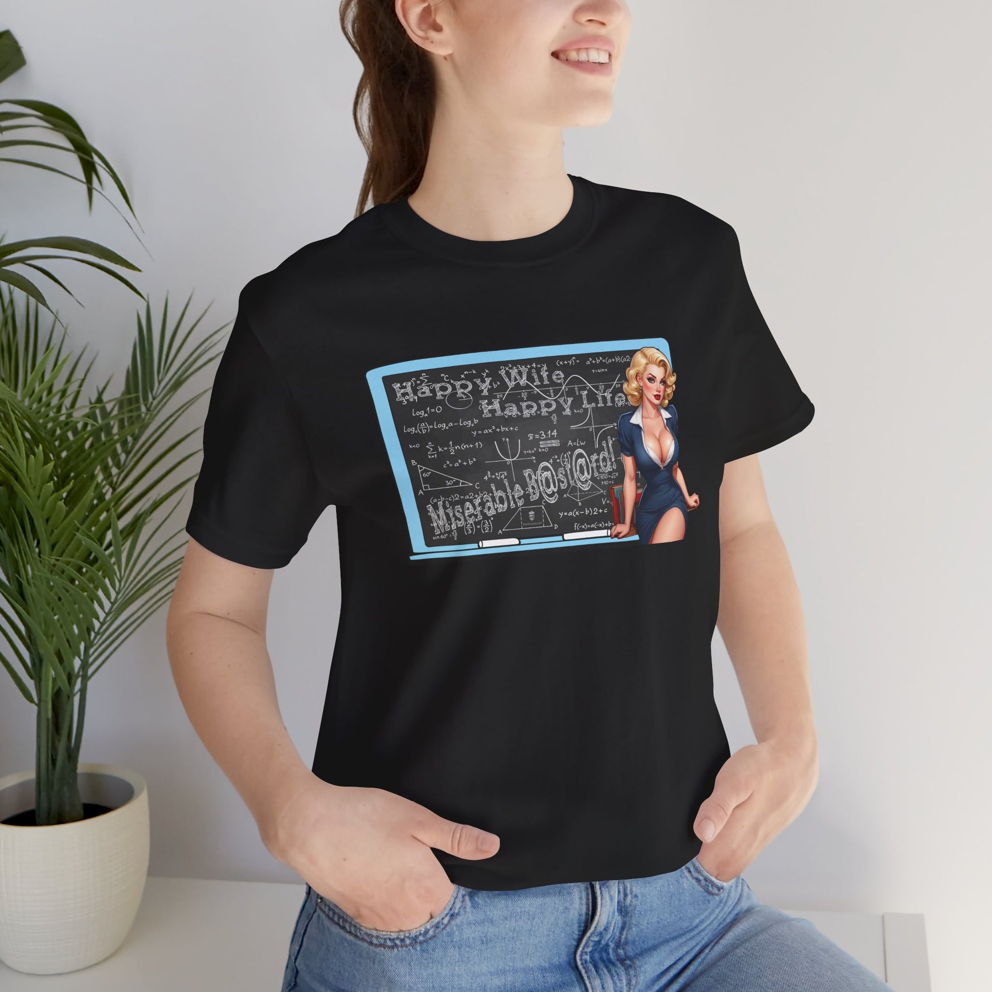 Person wearing a black t-shirt with text design in a minimalist room.