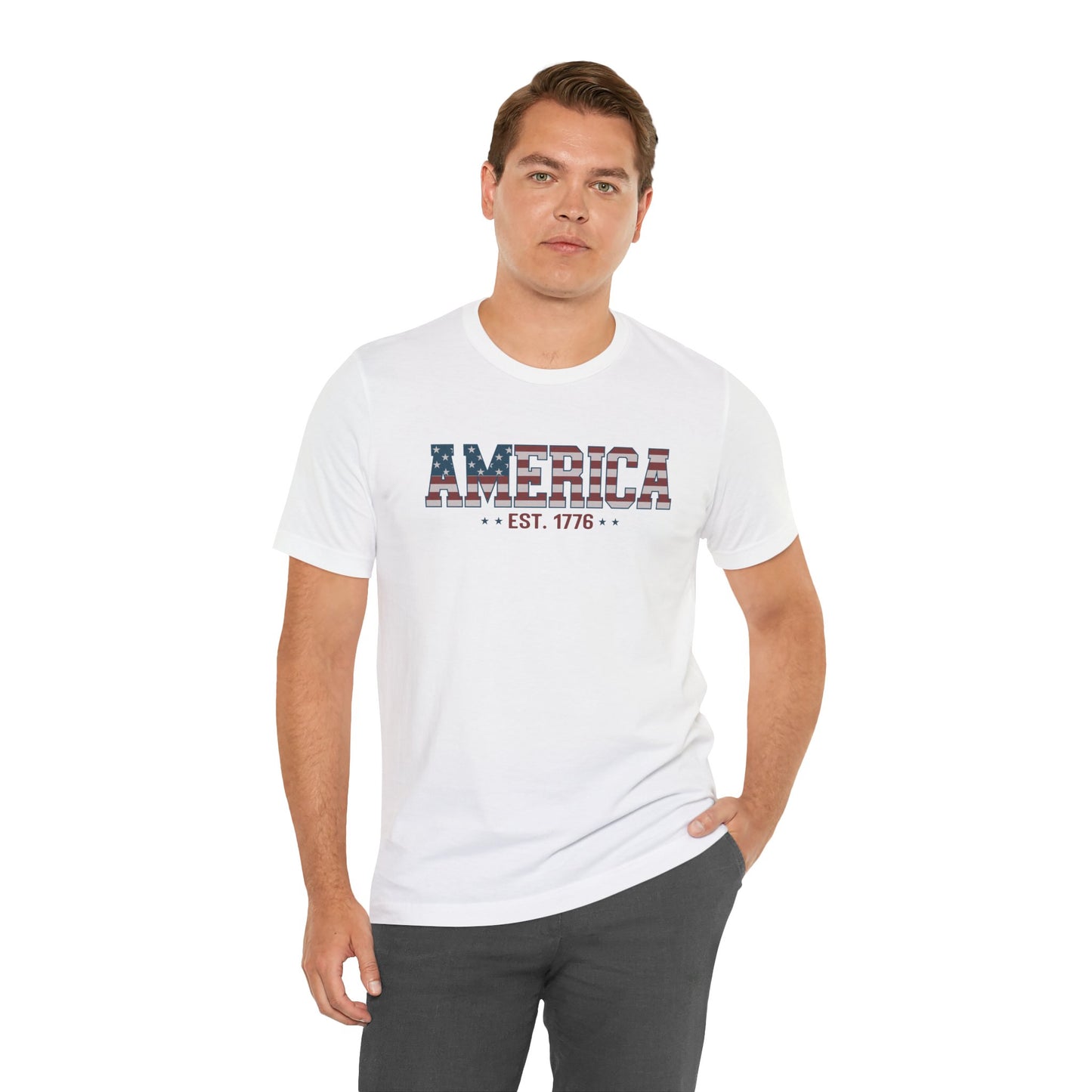 Man wearing a white t-shirt with 'AMERICA EST. 1776' text on a white background