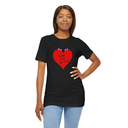 Woman wearing a black t-shirt with print in red on a white background