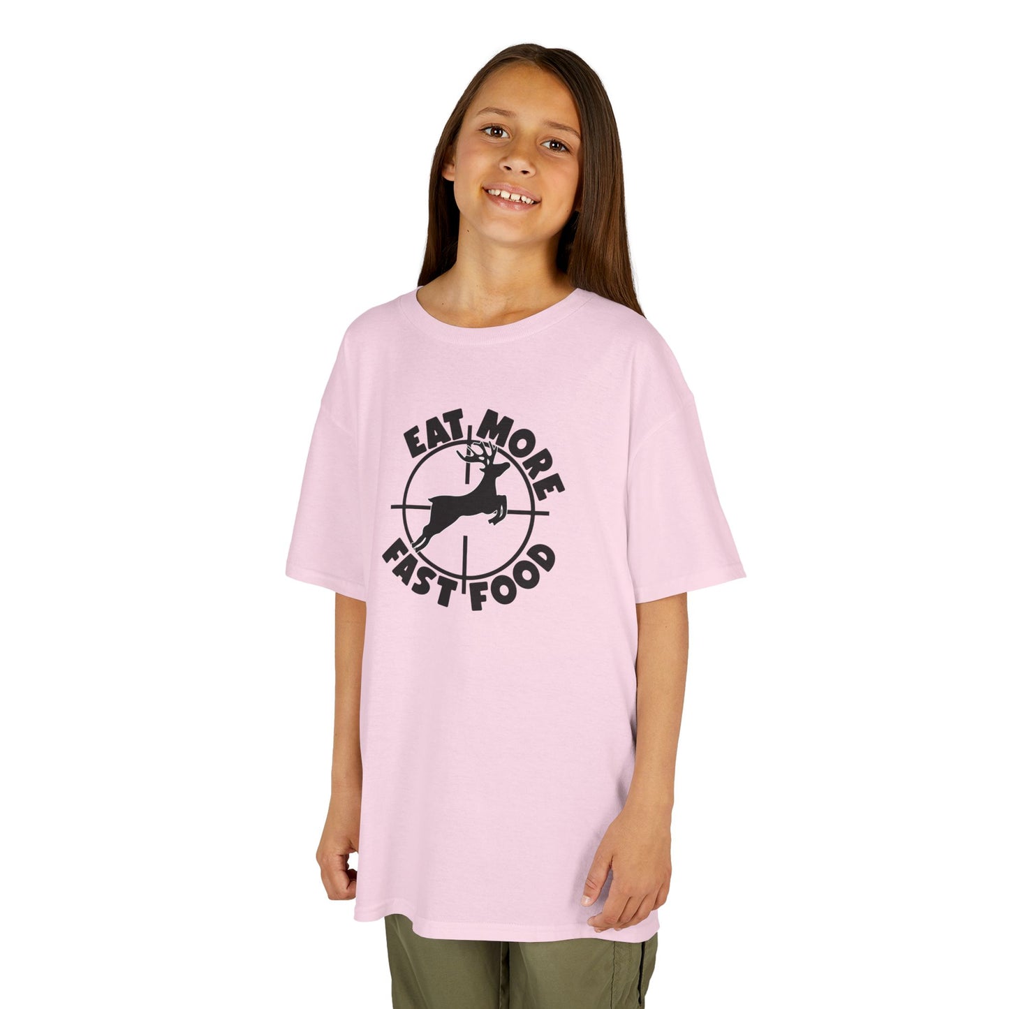 Young girl wearing a pink t-shirt with a colorful heart design on a white background