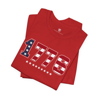 Red t-shirt with '1776' design on a white background