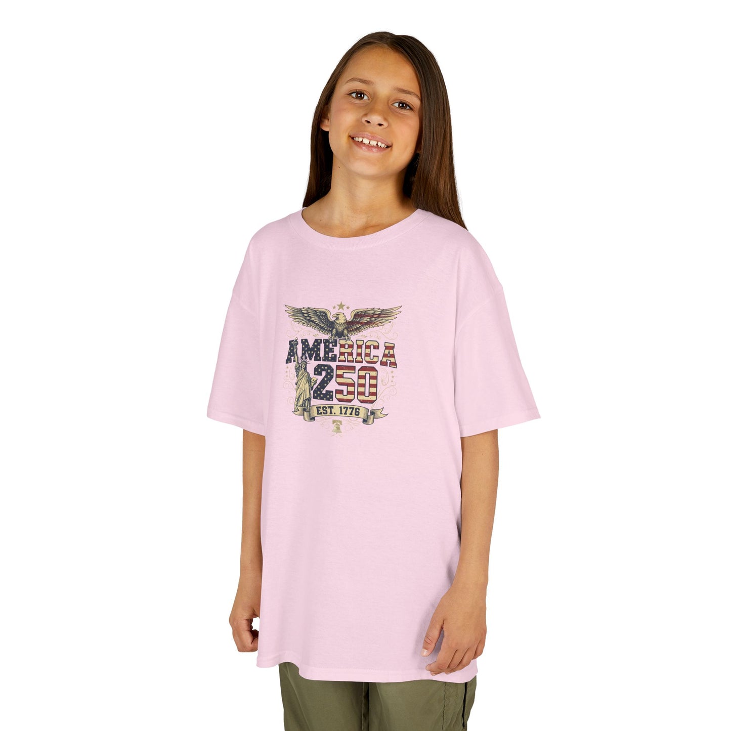 Young girl wearing a pink t-shirt with a colorful graphic design on a white background