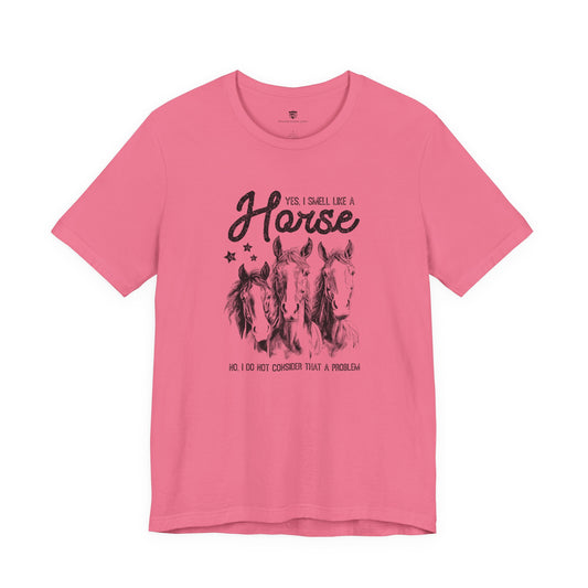Pink t-shirt with horse graphic and text 