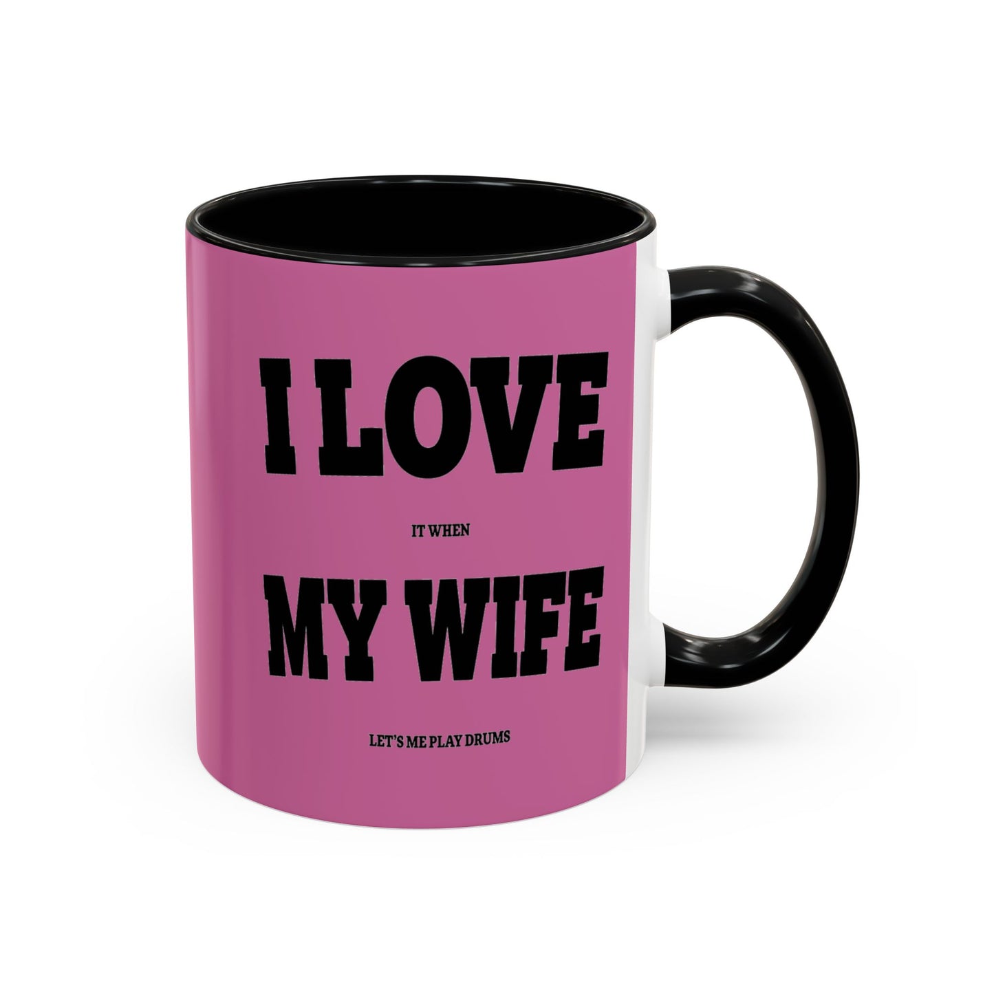 Pink mug with black text on a white background