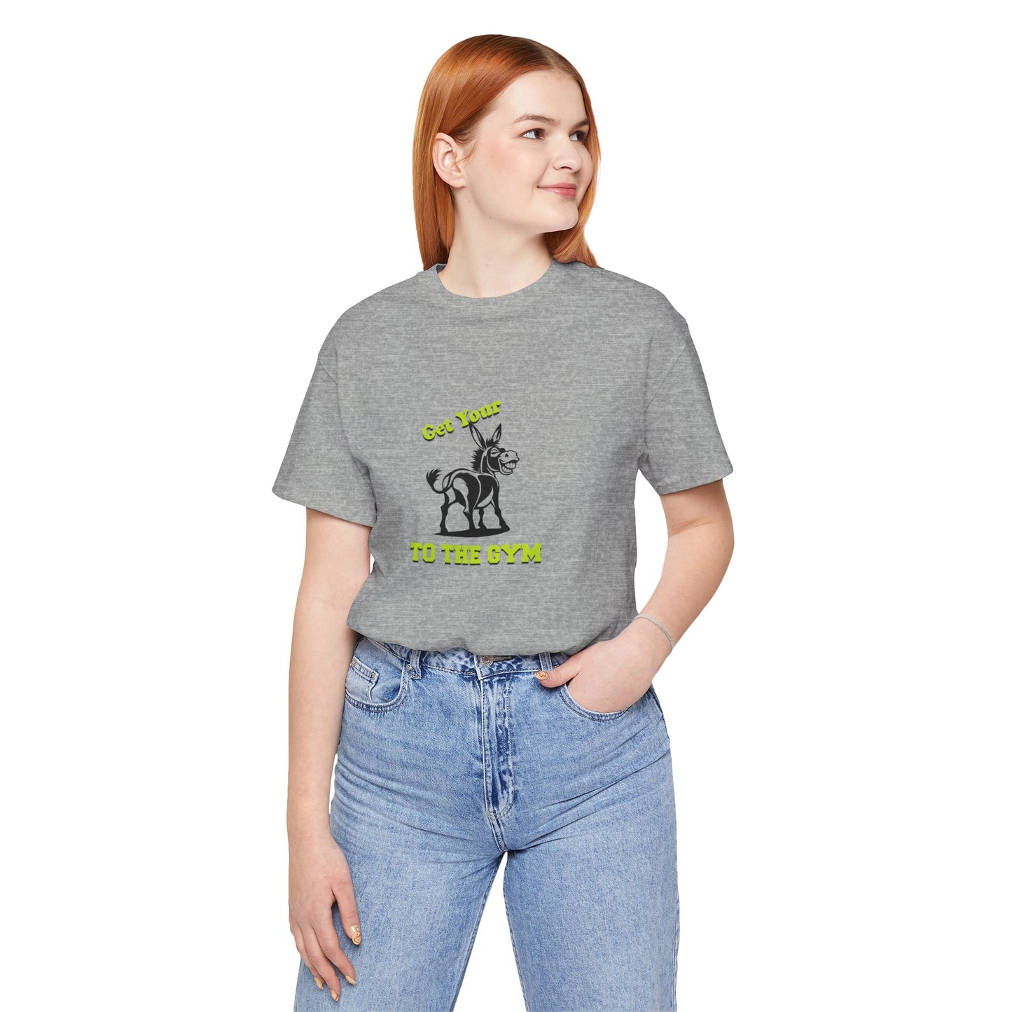 Person wearing a gray t-shirt with a logo and blue jeans on a white background