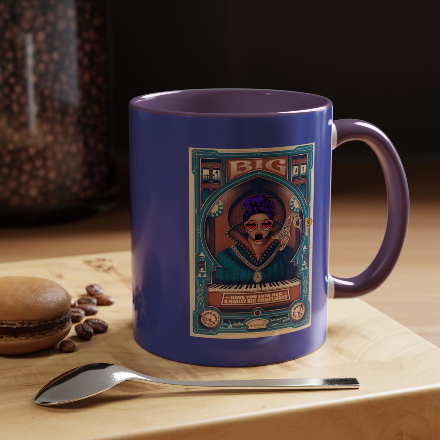 Blue mug with a decorative label on a wooden surface with coffee beans and a spoon.