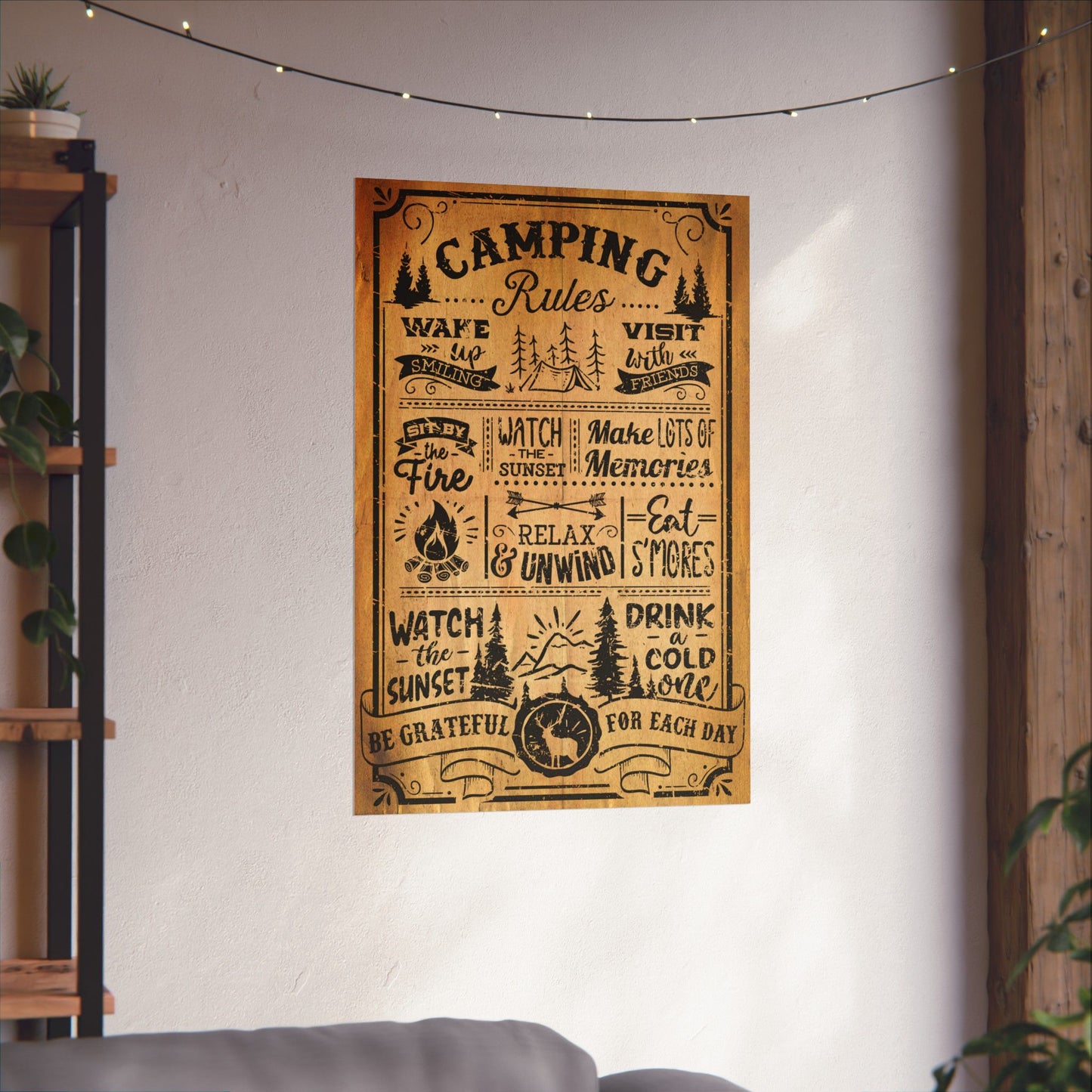 Poster with 'Camping Rules' text on a wall in a room with a shelf and plants.