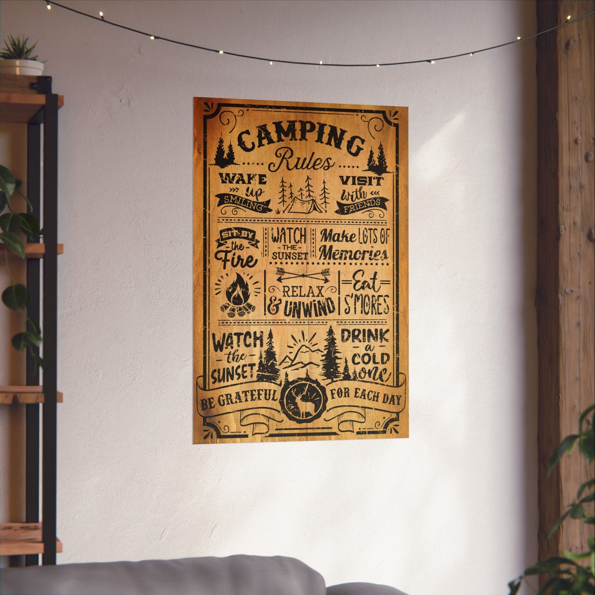 Poster with 'Camping Rules' text on a wall in a room with a shelf and plants.