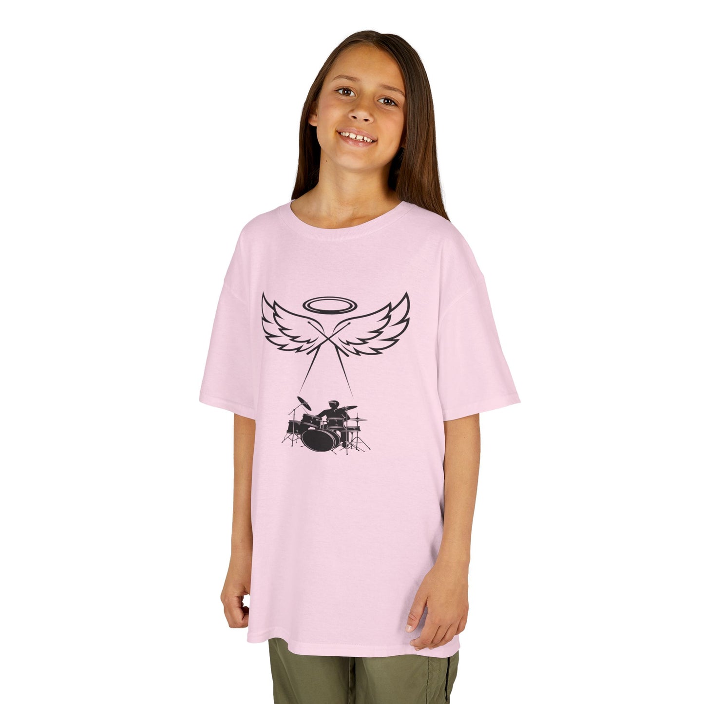 Young girl wearing a pink t-shirt with a graphic design on a white background