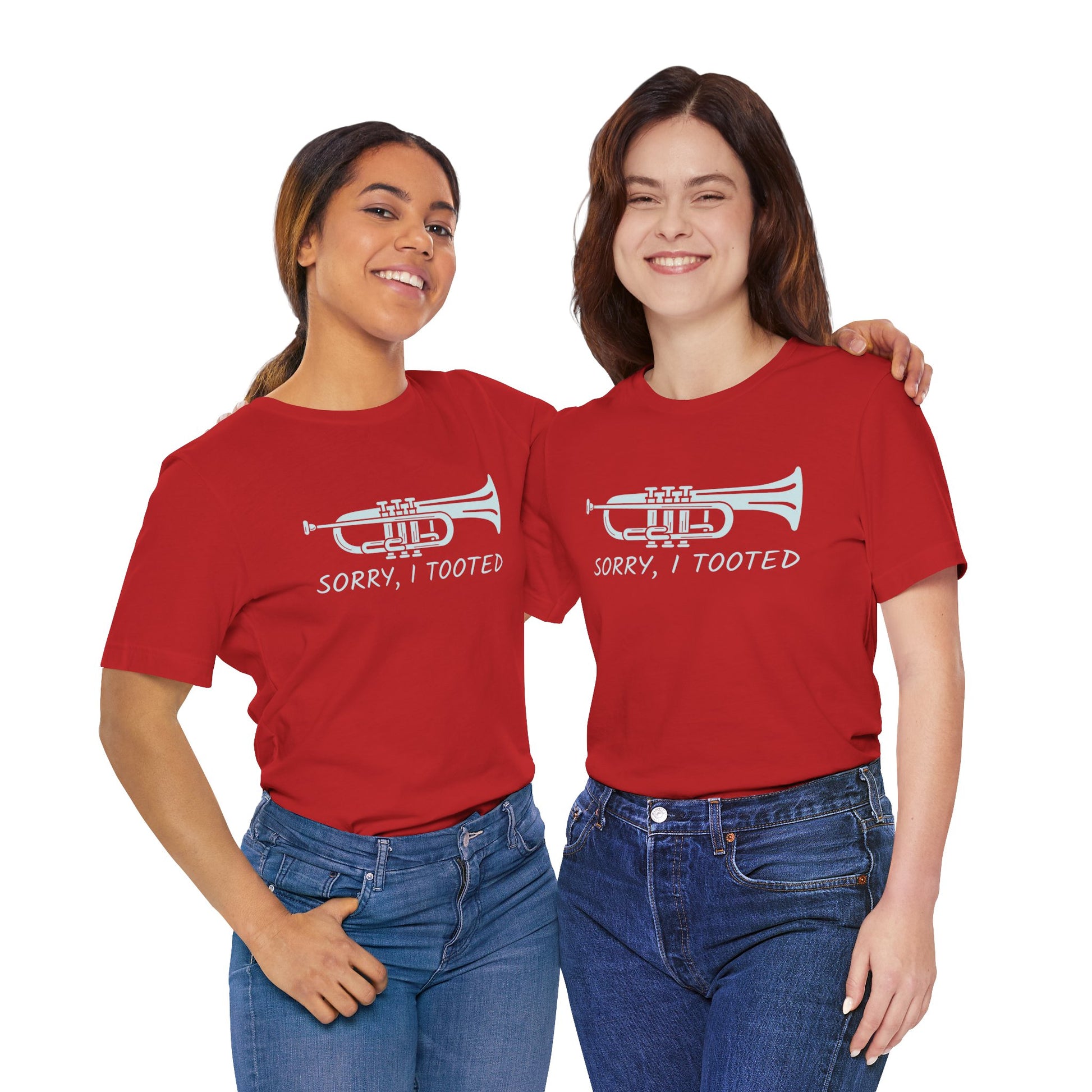 Two people wearing red t-shirts with a trumpet graphic and text on a white background