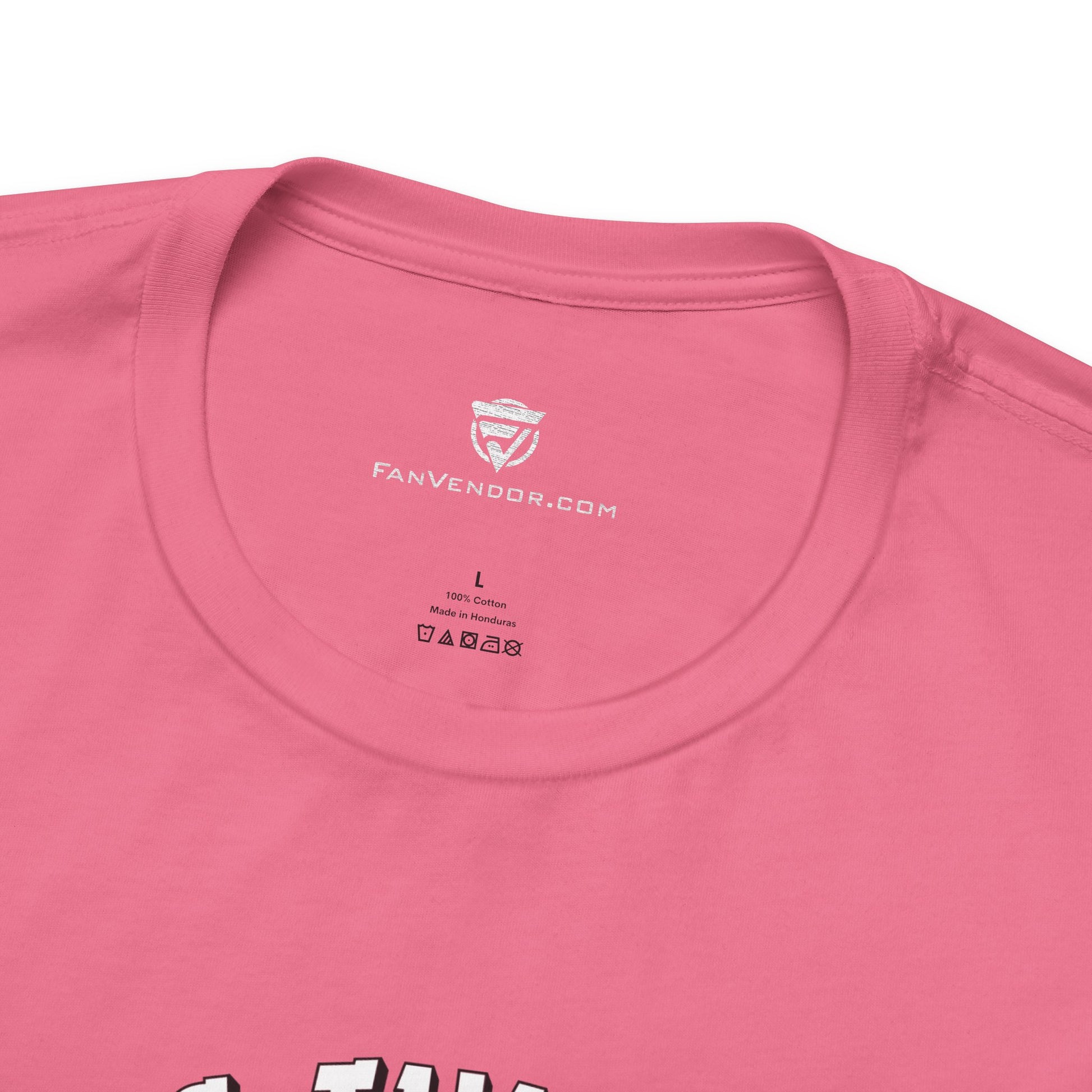 Close-up of a pink t-shirt with 'Fanvendor.com' logo on the collar.