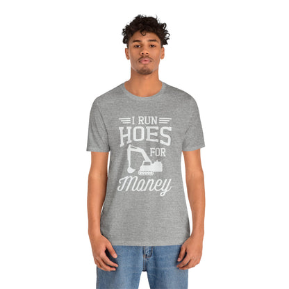 Person wearing a gray t-shirt with text and graphic design on a white background
