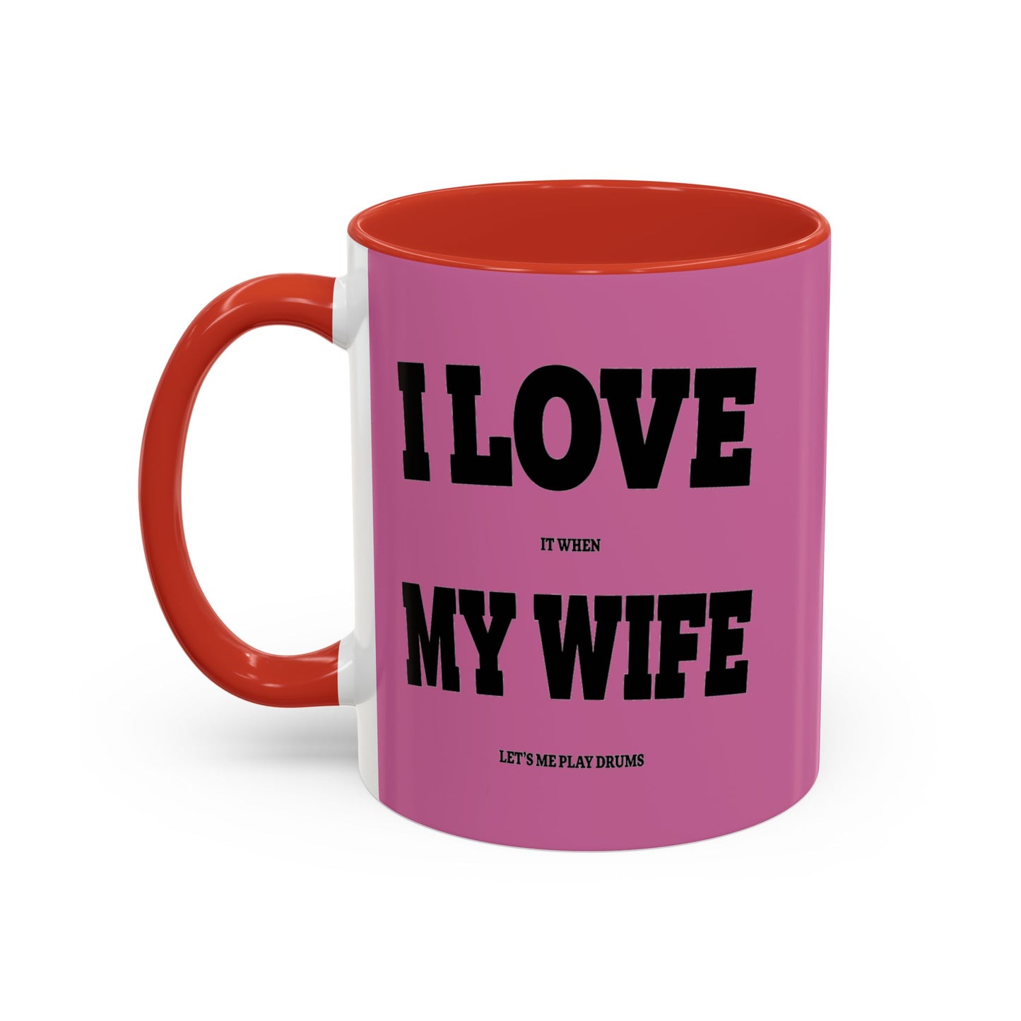 Pink mug with red interior and handle, featuring text on a white background