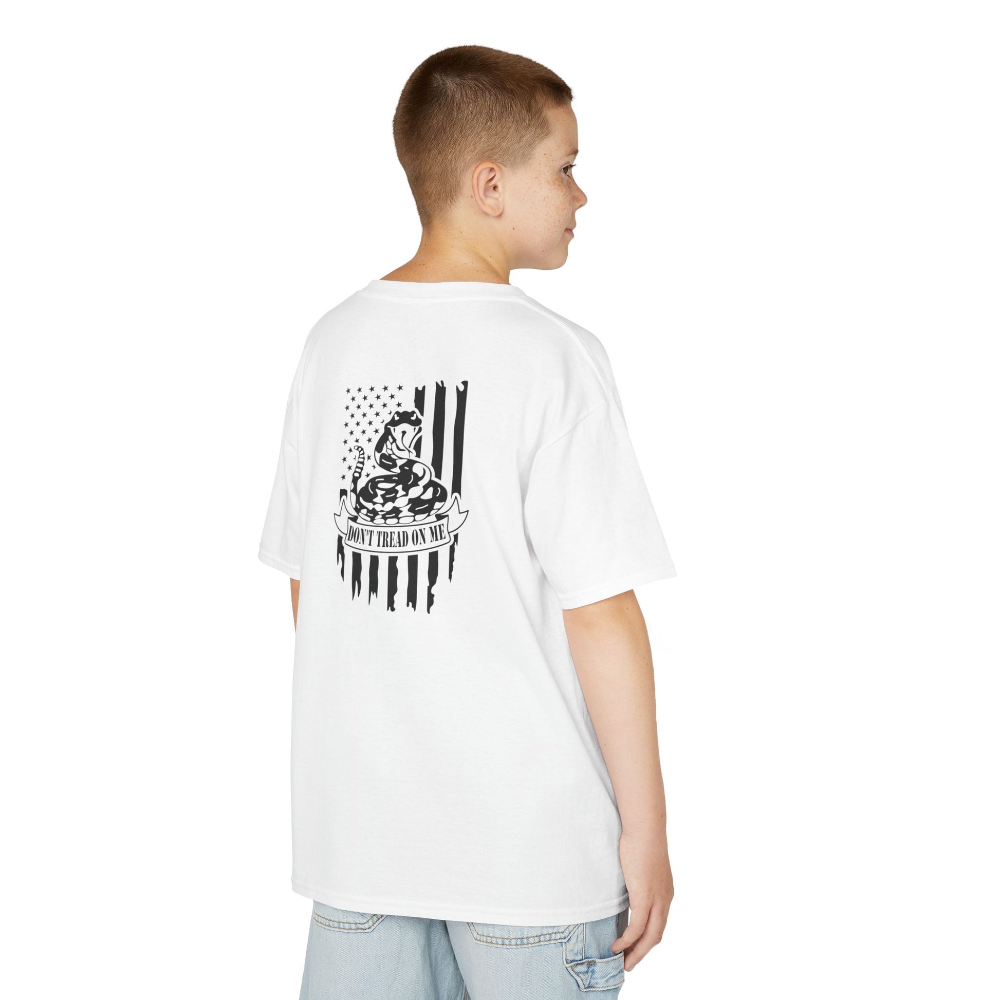 Person wearing a white t-shirt with a graphic design on the back, standing against a white background