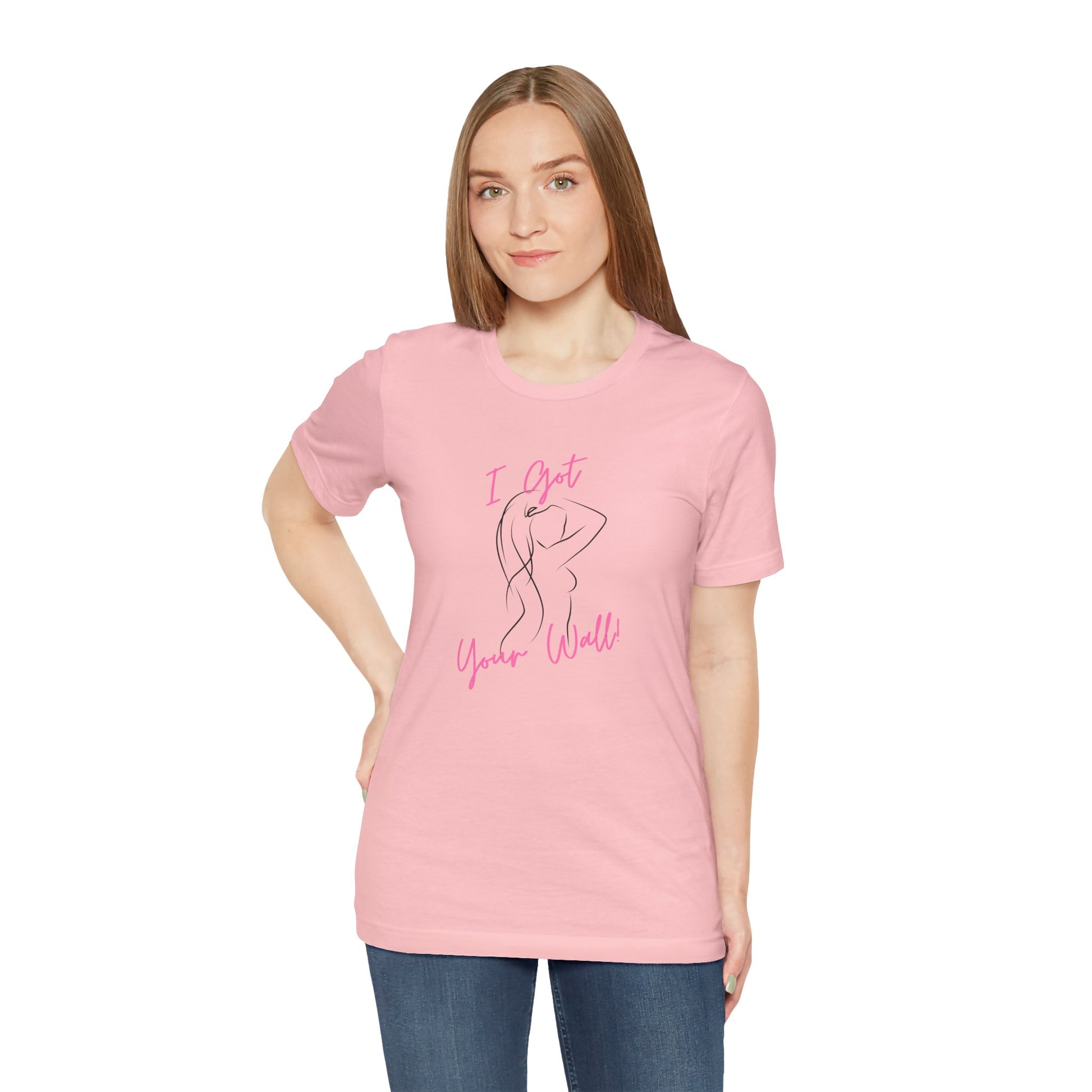 Person wearing a pink t-shirt with text on a white background