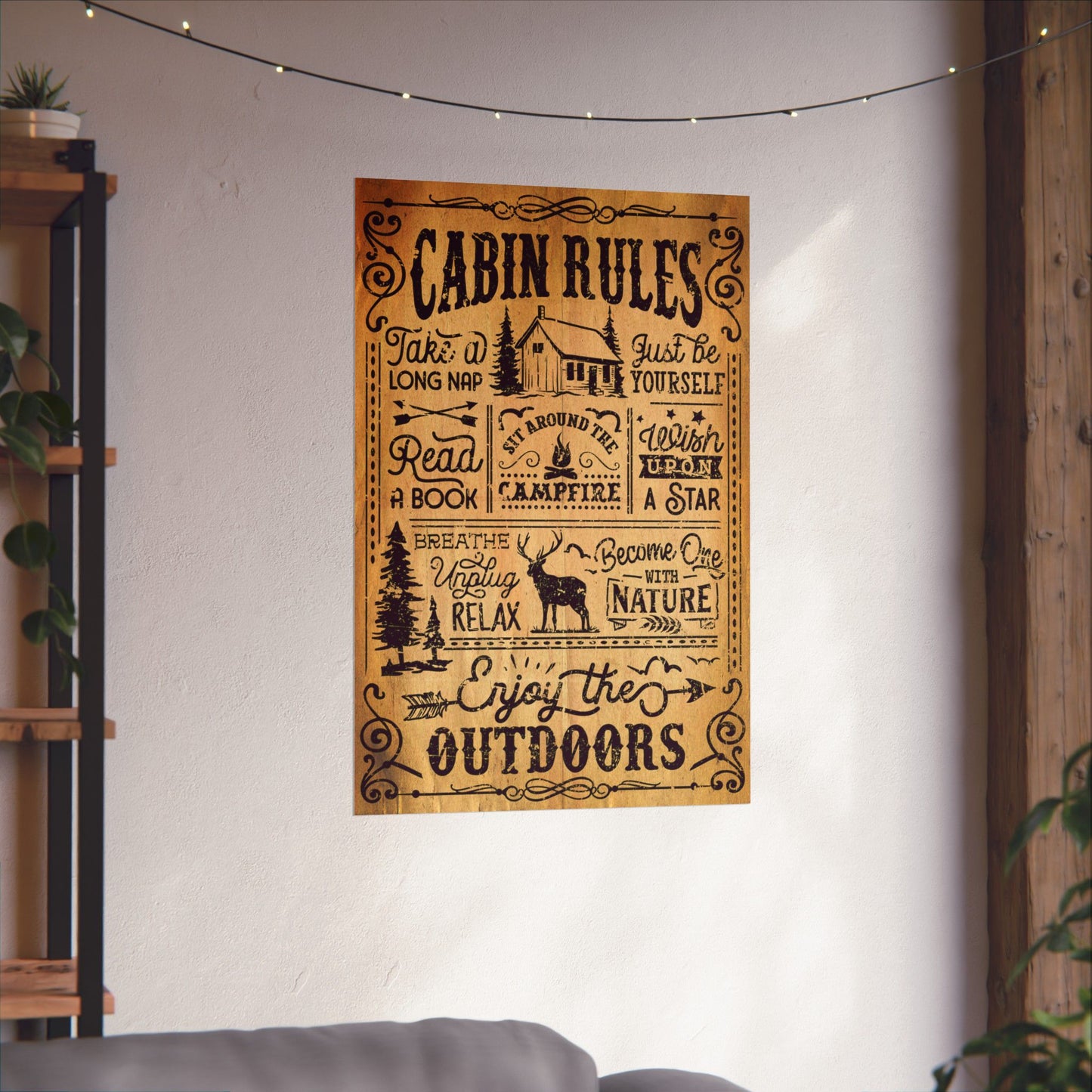 Poster with 'Cabin Rules' text and illustrations on a wall in a cozy room.