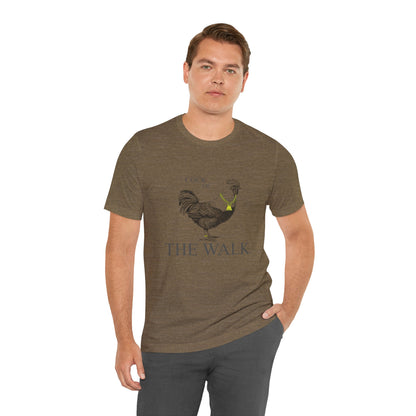 Man wearing a green t-shirt with a rooster graphic and text on a white background