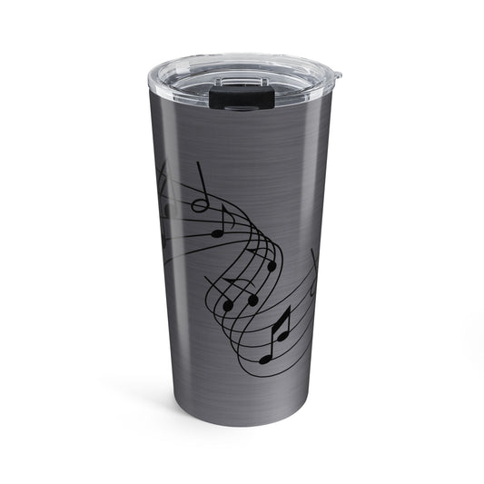 Silver tumbler with black music note design on a white background