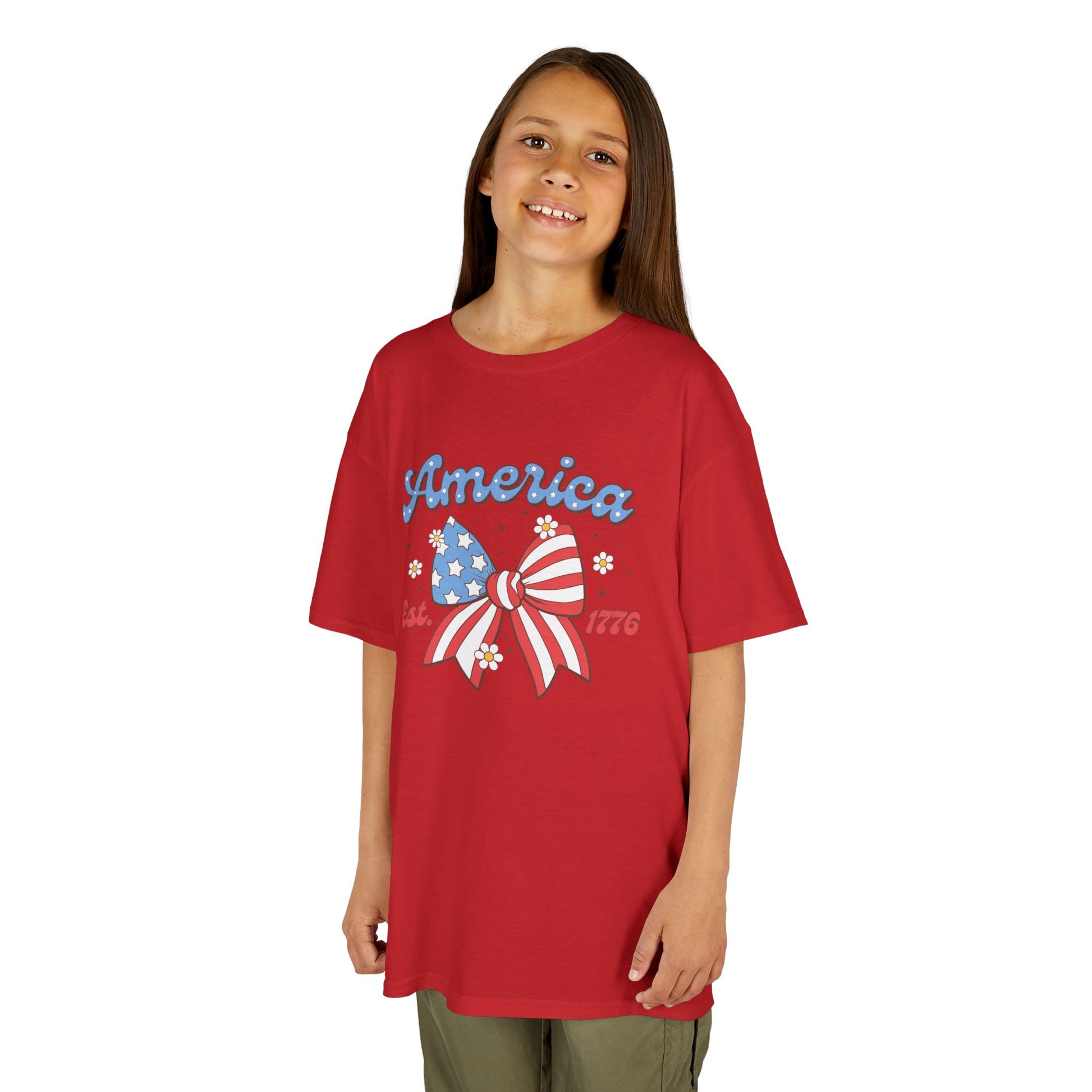 Girl wearing a red t-shirt with 'America' and a bow graphic on a white background