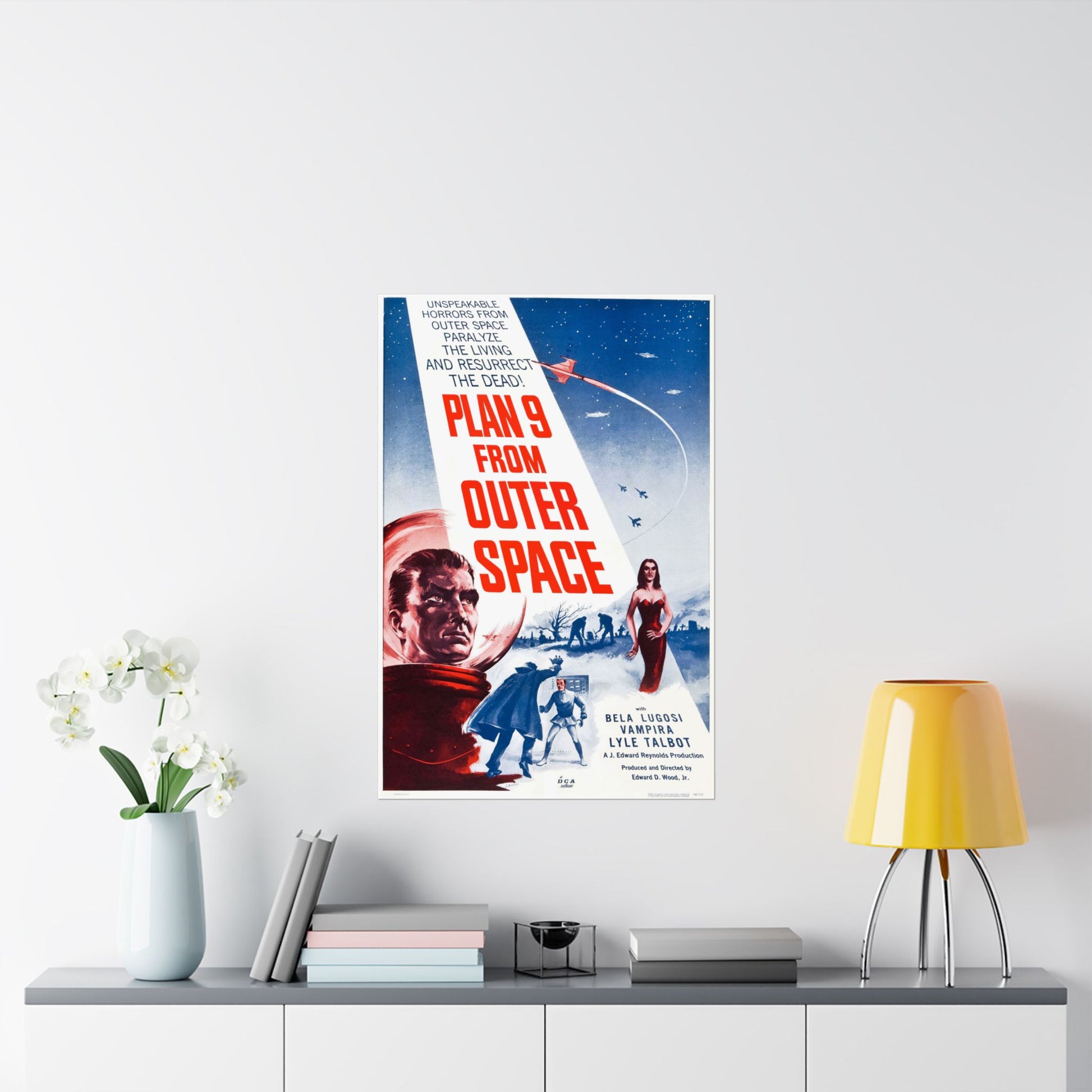 Movie poster for 'Plan 9 from Outer Space' on a wall above a shelf with decor items.