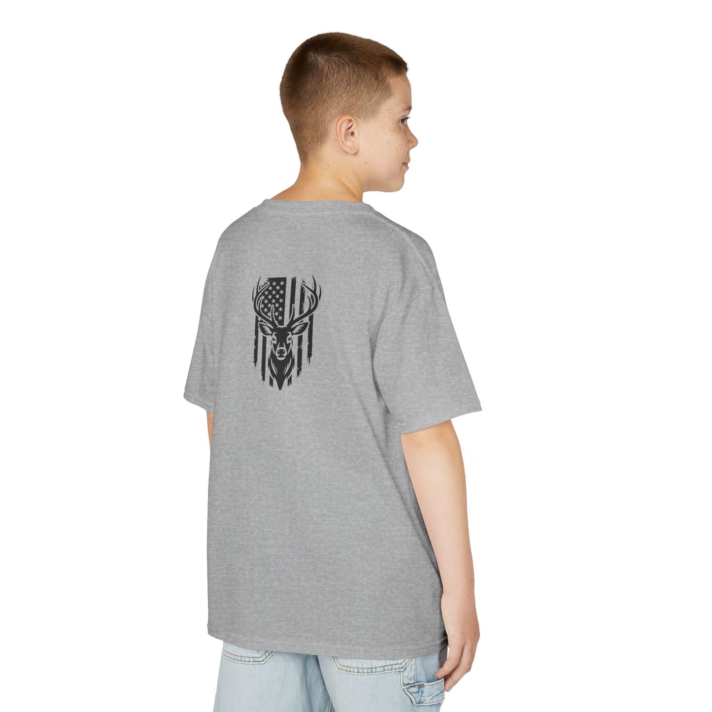 Person wearing a gray t-shirt with a graphic design on the back, standing against a white background