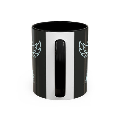 Black mug with white stripe and wing-like designs on a white background