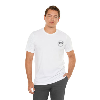Man wearing a white t-shirt with 1776 design on a white background