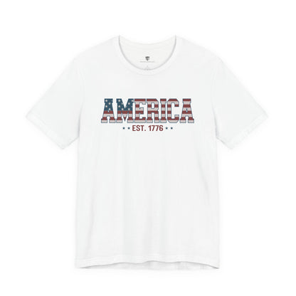 White t-shirt with 'AMERICA EST. 1776' text on a white background