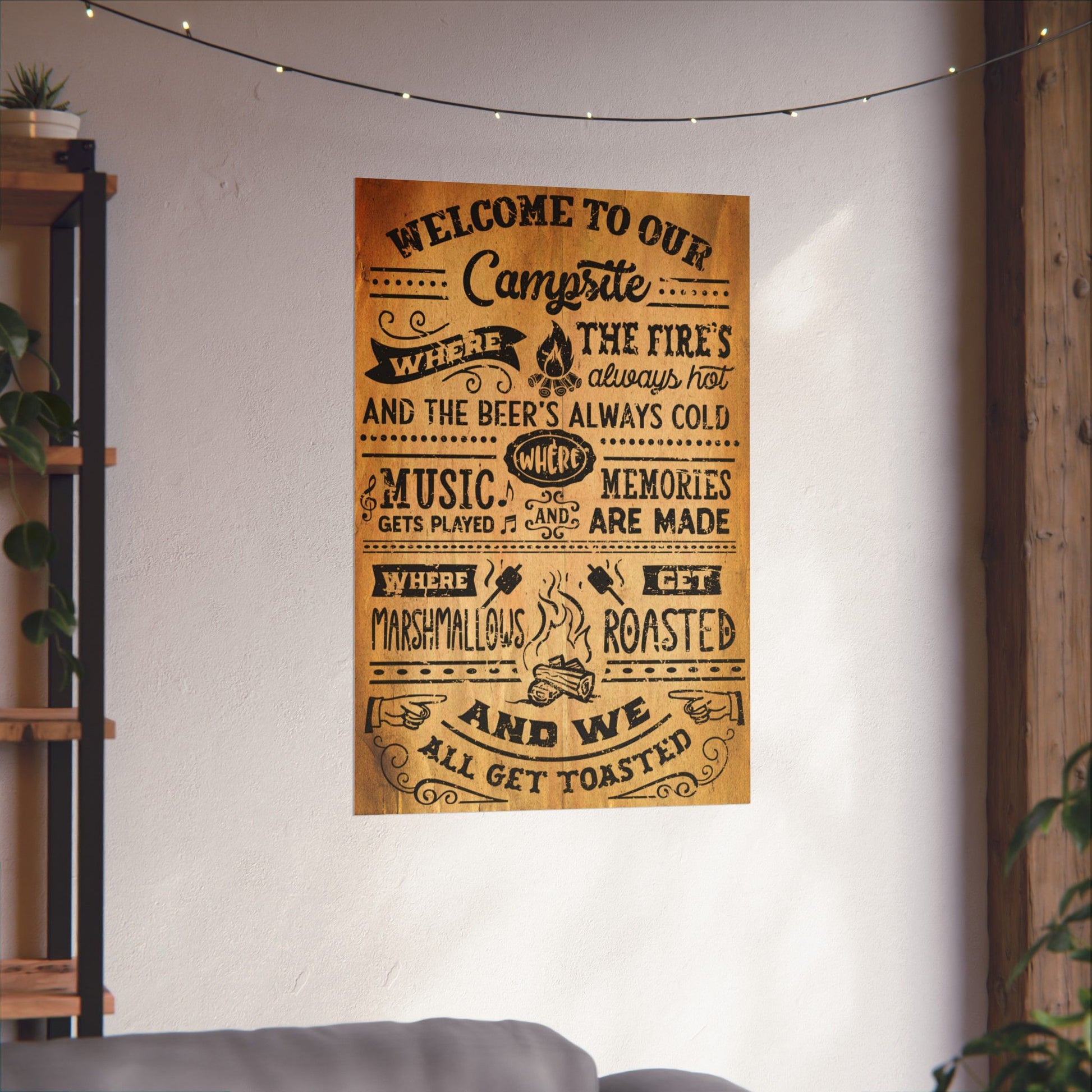 Decorative wall poster with text on a white wall in a cozy room.