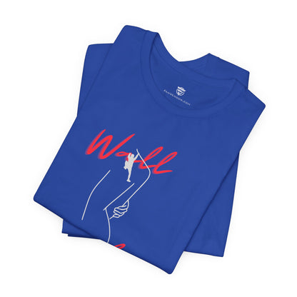 Folded blue t-shirt with red and white graphic design on a white background