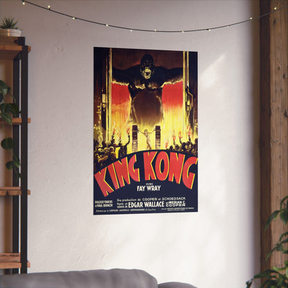 King Kong movie poster on a wall in a room with a shelf and plants.