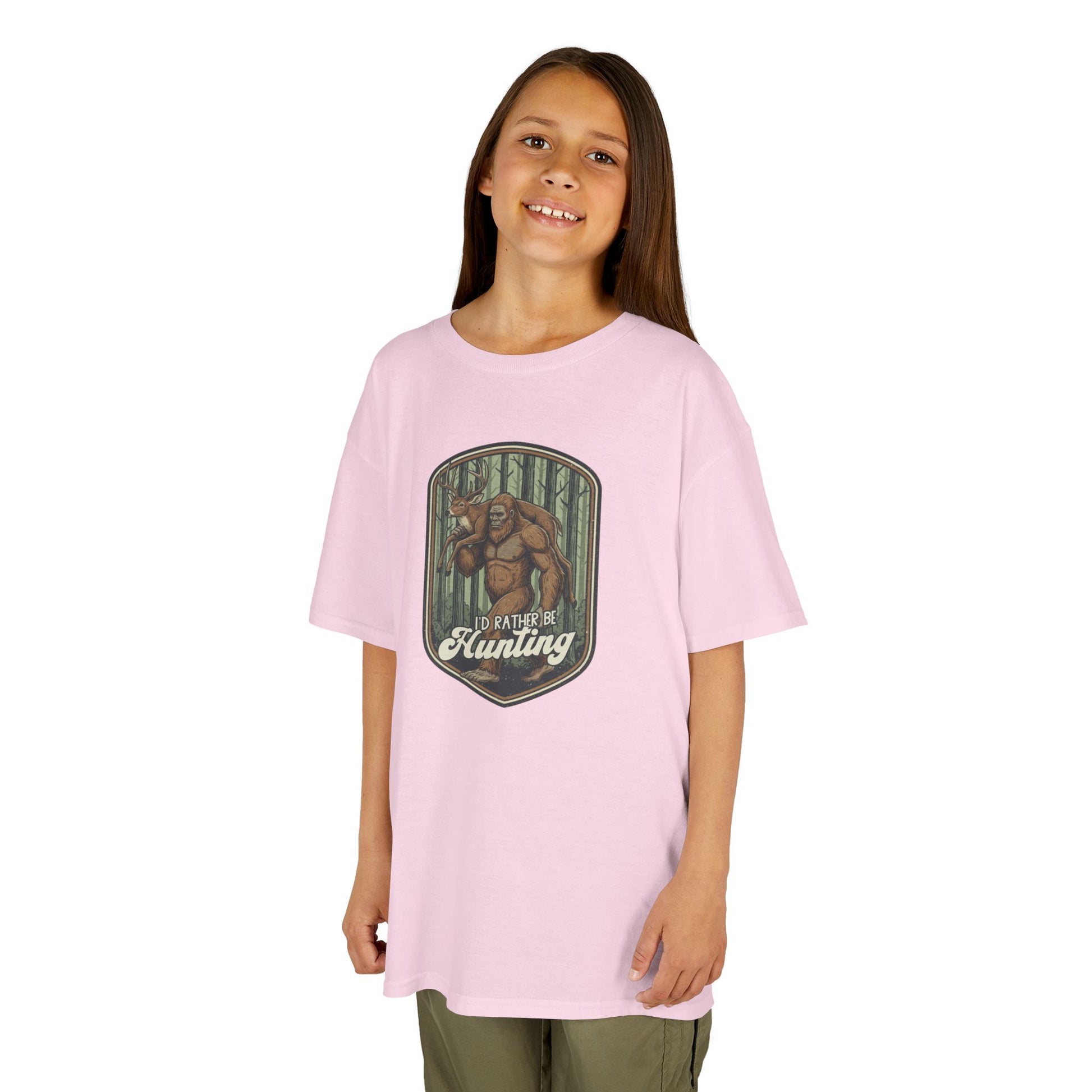 Young girl wearing a pink t-shirt with a graphic design on a white background
