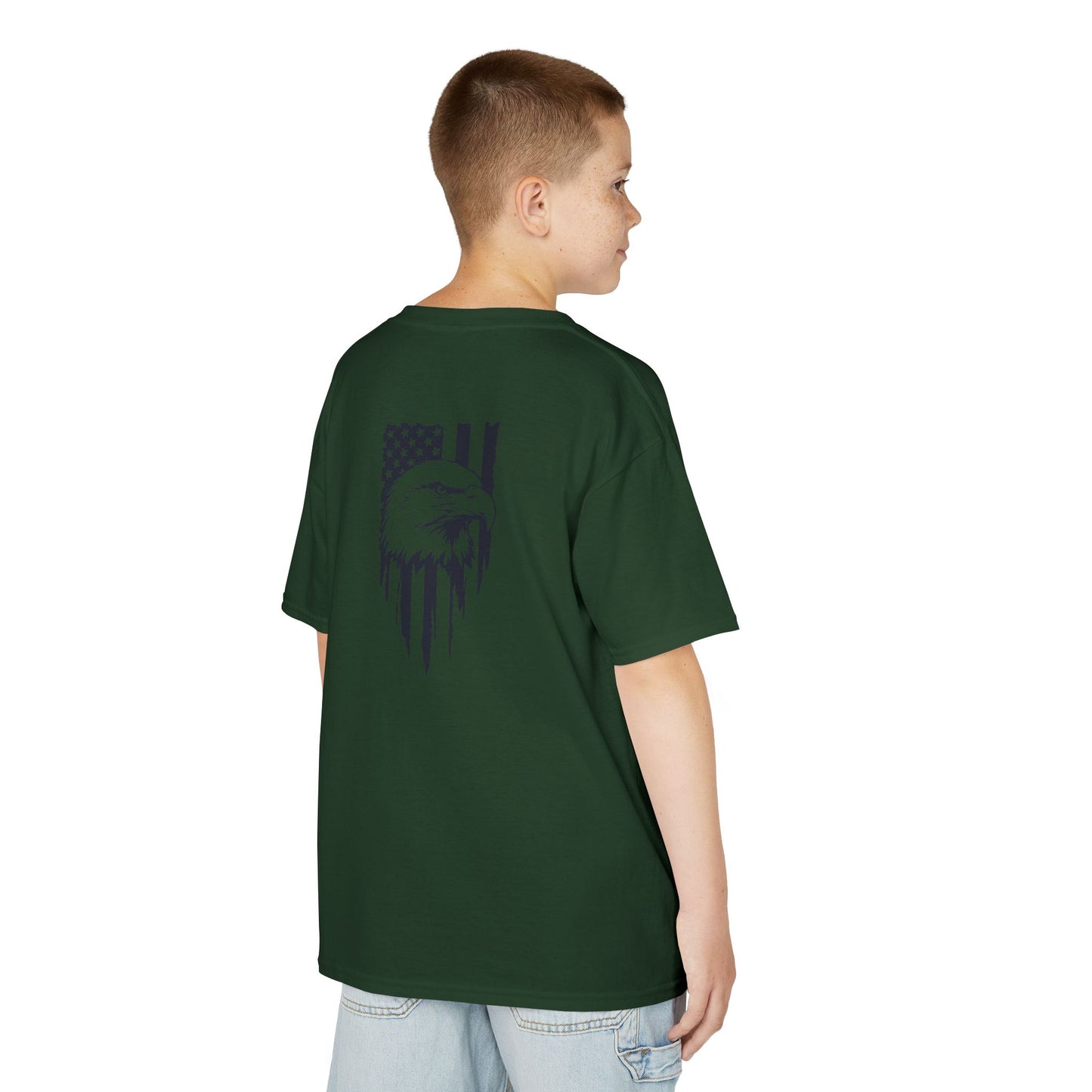Child wearing a green t-shirt with a graphic design on the back, standing against a white background