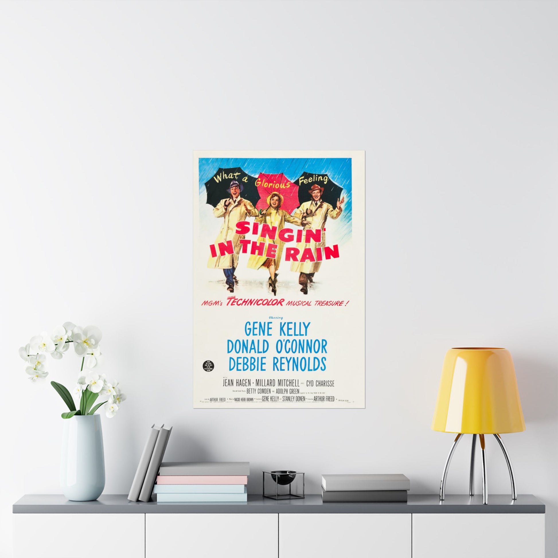 Movie poster for 'Singin' in the Rain' on a wall above a shelf with decor items.
