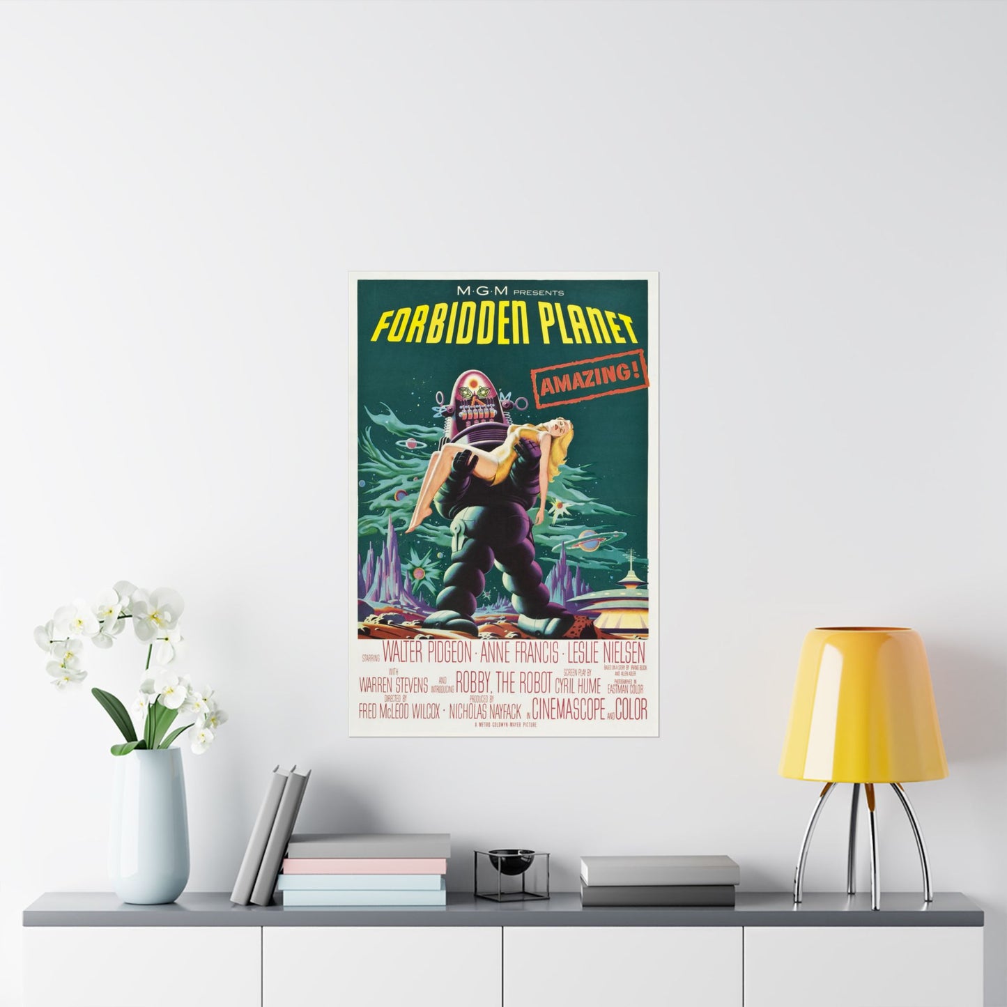 Vintage 'Forbidden Planet' movie poster on a wall above a shelf with decor items.
