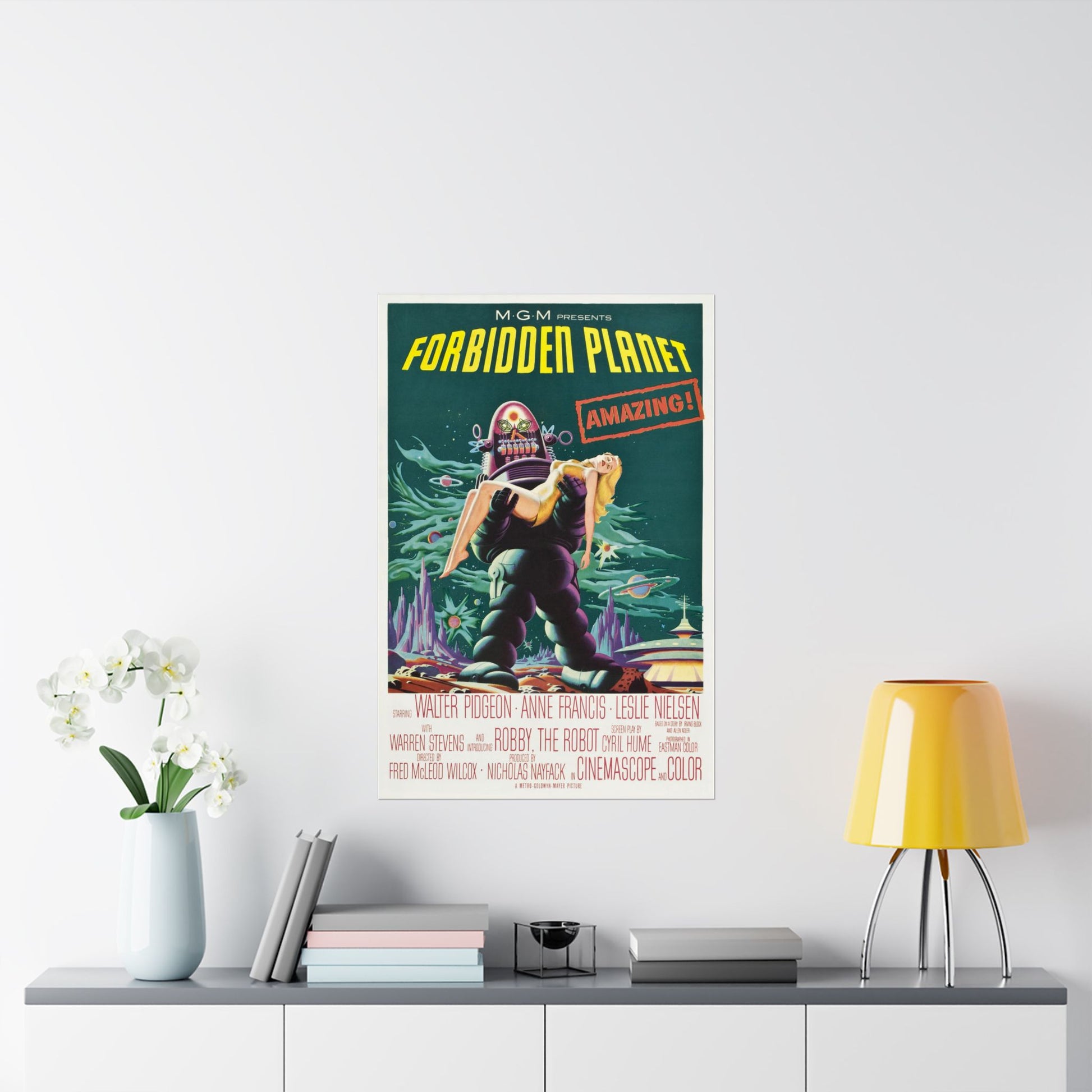 Vintage 'Forbidden Planet' movie poster on a wall above a shelf with decor items.