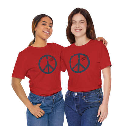 Two people wearing red t-shirts with peace symbol designs on a white background