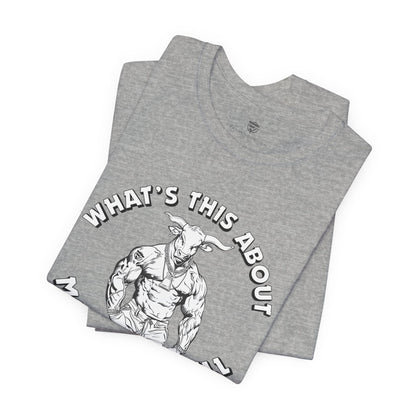 Black t-shirt with a graphic and text folded on a white background.