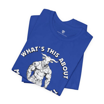 Blue t-shirt with a graphic of a muscular figure and text 'WHAT'S THIS ABOUT' on a white background.