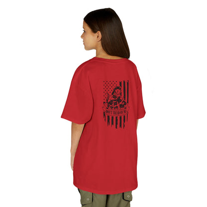 Person wearing a red t-shirt with an eagle and flag design on the back, on a white background