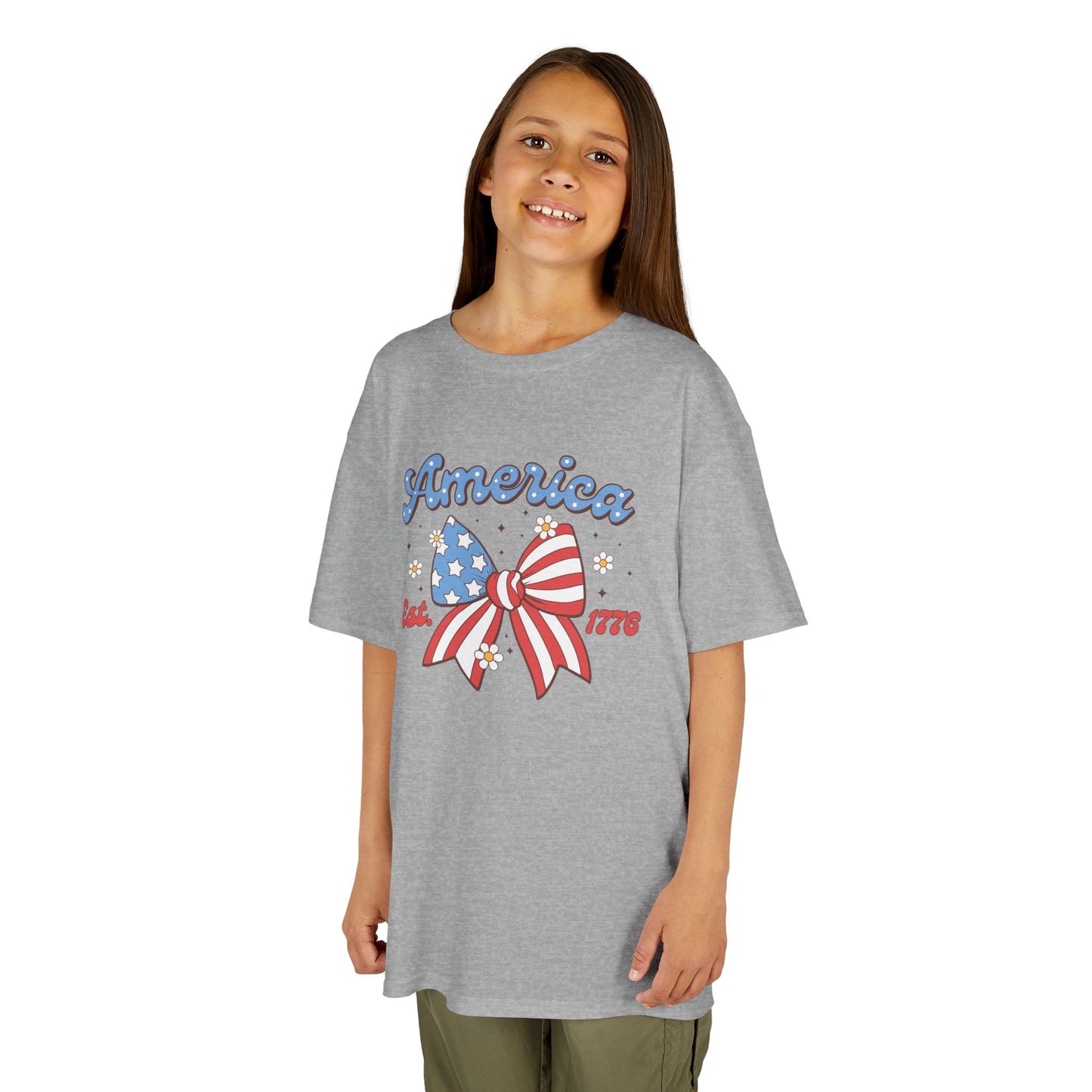 Girl wearing a gray t-shirt with 'America' and a bow design on a white background