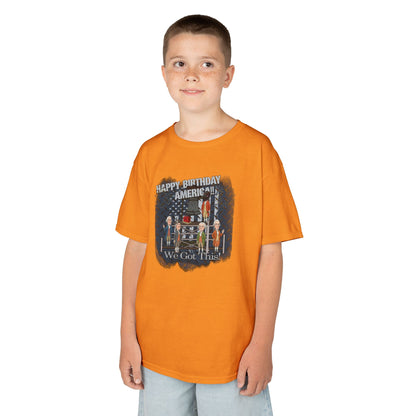 Child wearing an orange t-shirt with a graphic design on a white background