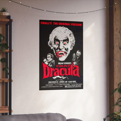 Count Dracula movie poster on a wall in a room with a couch and shelves.