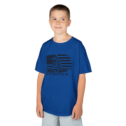 Child wearing a blue t-shirt with a graphic design on a white background